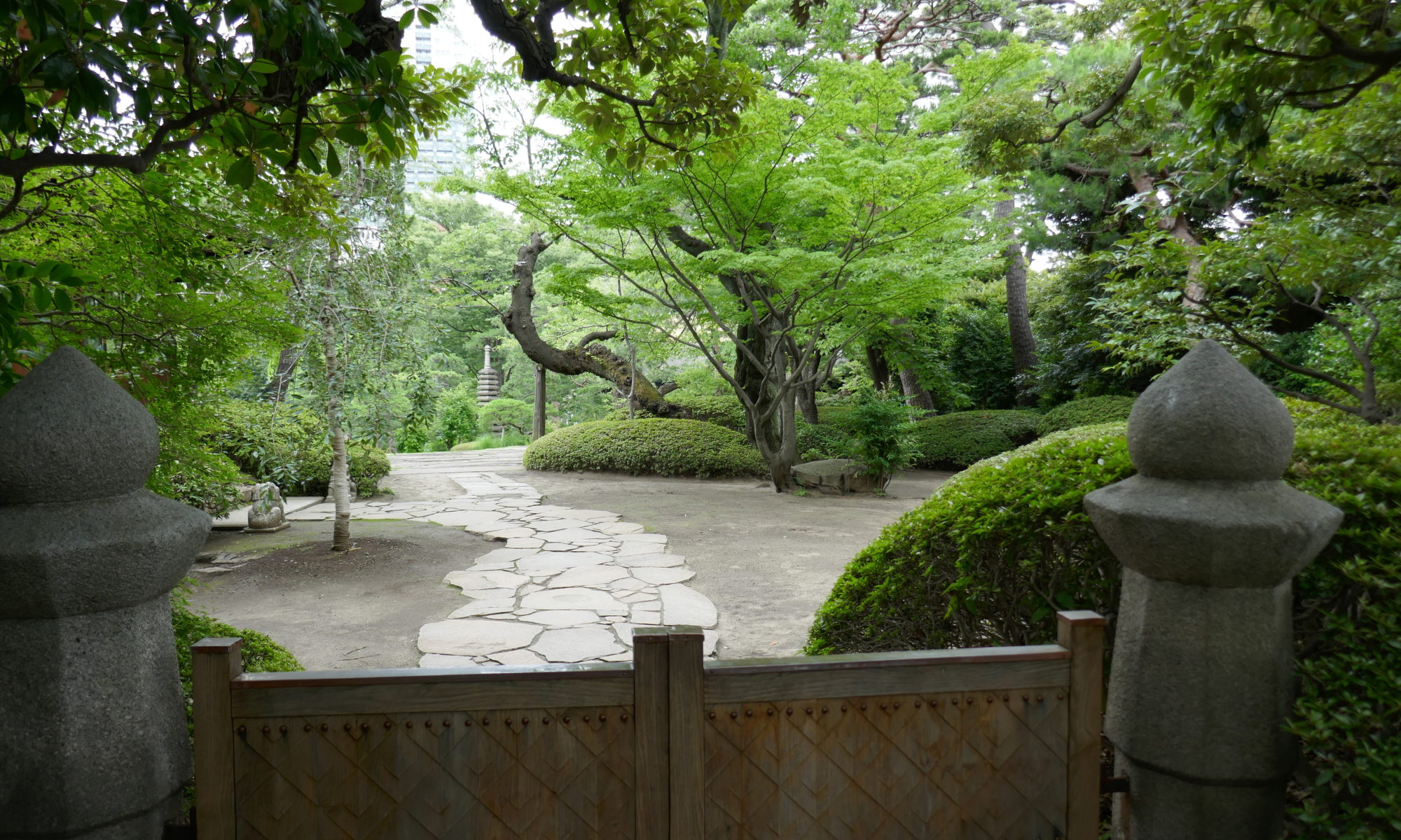 View over a gate into Happo-en Garden Tokyo